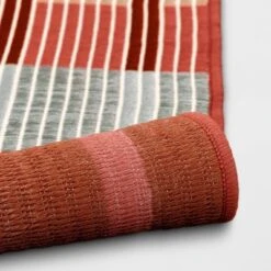 7'x10' Dashed Stripe Outdoor Rug Warm - Threshold™ -Outdoor Furniture Store GUEST b8fbbf76 f033 4c66 93bc f2e802cd60dd